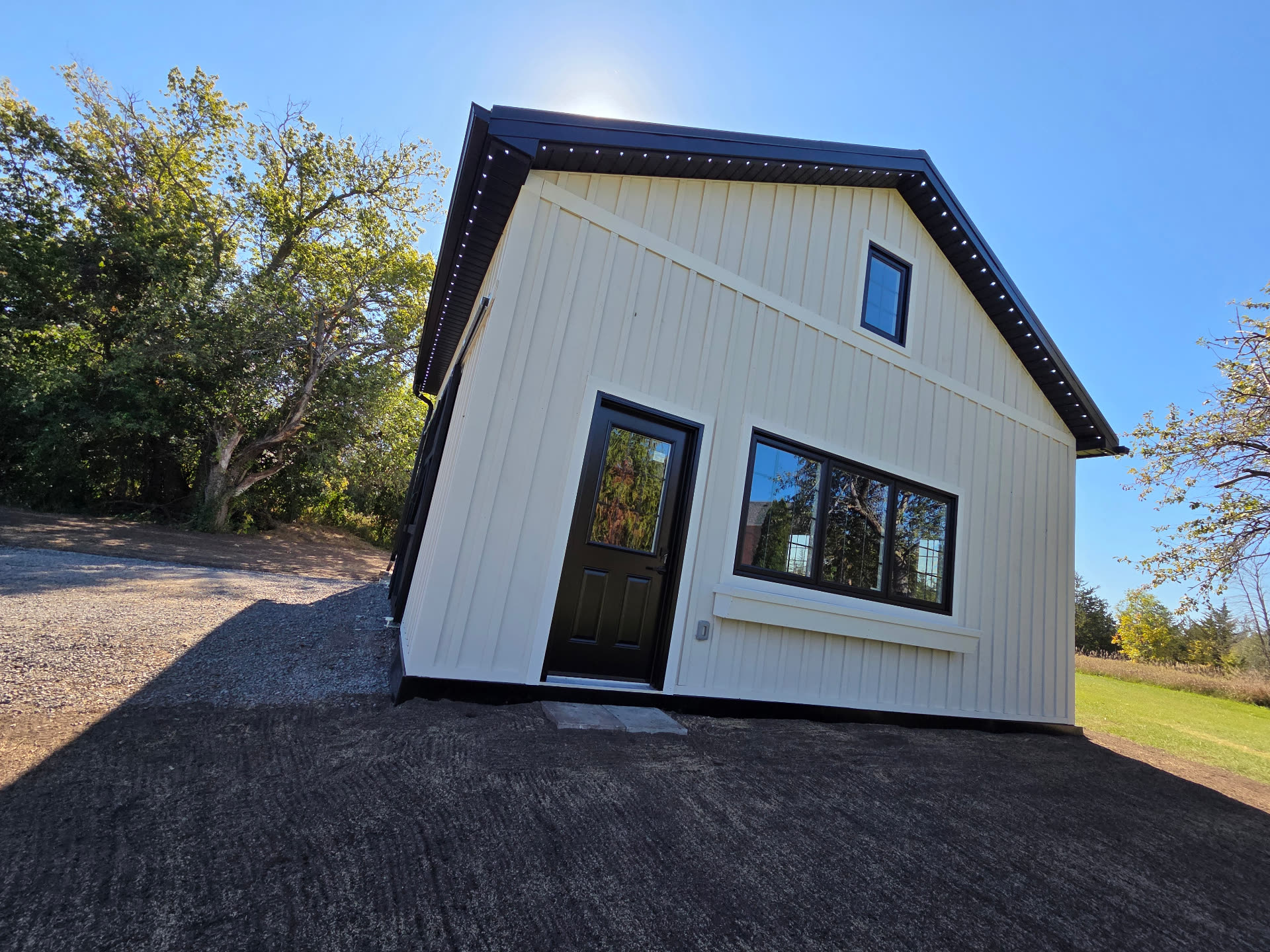 Front gable of a Belleville-area barn with permanent LED lighting track neatly fitted under the eaves