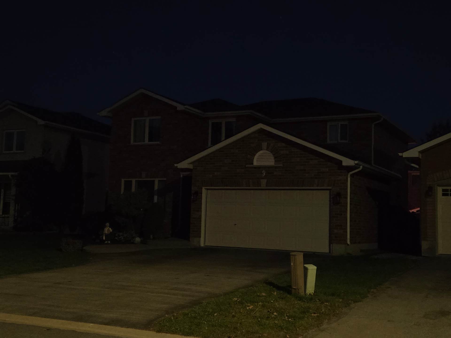 Belleville brick home at night before the permanent LED lights are switched on